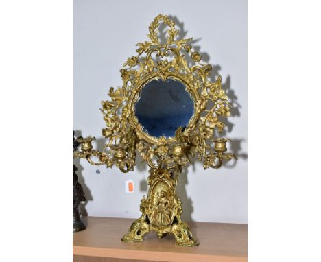 A LATE 19TH CENTURY GILT METAL FRAMED TOILET MIRROR ON STAND, the circular mirror surrounded by an ornate open foliate frame 