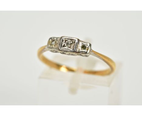 A YELLOW METAL THREE STONE DIAMOND RING, set with single cut diamonds, one diamond is missing, tapered shoulders, stamped 18c