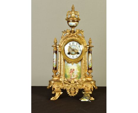 A LATE 19TH CENTURY GILT METAL AND PORCELAIN MANTEL CLOCK, hand painted urn finial front panel and side columns, the porcelai