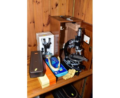 A CASED J SWIFT &amp; SON  OF LONDON ELECTRIC MICROSCOPE, with two pin plug (untested) model no 22565, the case containing va