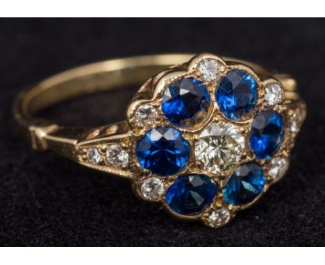 An Edwardian 18 ct gold diamond and sapphire set cluster ringSize M, cased.    CONDITION REPORTS:  Generally good condition, 