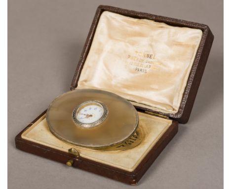 A 19th century French unmarked silver mounted agate desk clockOf oval form, with ornately pierced undertier, the white enamel