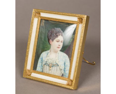 An unmarked gold, ivory mounted photograph frame Enclosing an untested white stone and pearl set portrait miniature of a lady