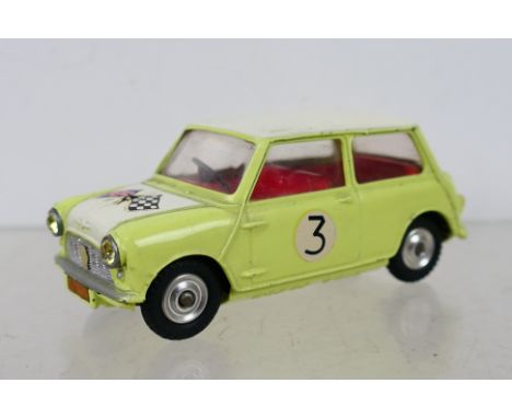 Corgi Toys - An unboxed Corgi Toys #227 Morris Mini-Cooper Competition Model. The model with primrose yellow body, white roof