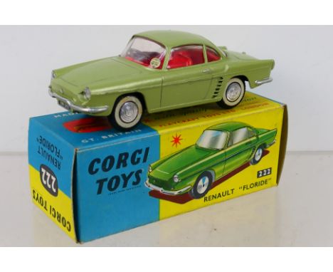 Corgi Toys - A boxed Corgi Toys #222 Renault Floride. The model in light olive, red interior with spun hubs, has had its whee