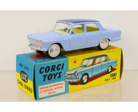 Corgi Toys - A boxed Corgi Toys #217 Fiat 1800. The model in light blue with dark blue roof, lemon interior with spun hubs, h