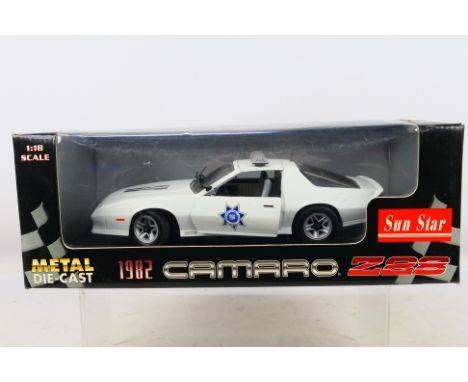 Sun Star - A boxed 1:18 scale Sun Star #1926 1982 Arizona Highway Patrol Camaro Z28. The model shows dusty signs of display, 