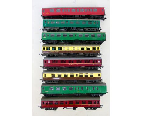 Tri-ang - An unboxed rake of eight Tri-ang TT passenger coaches. Lot includes Tri-ang W301 Restaurant Car in brown and umber;