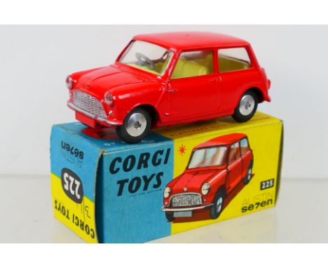 Corgi Toys - A boxed Corgi Toys #225 Austin 7 (Mini) Saloon. The model with red body, lemon interior, flat spun hubs, has a c
