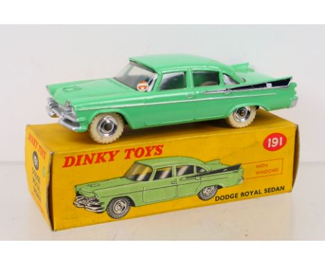 Dinky Toys - A boxed Dinky Toys #191 Dodge Royal Sedan. The model with green body and black side flash, spun hubs, white tyre