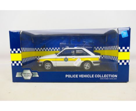 Model Icons - A boxed Limited Edition 1:18 scale Model Icons #999004 Ford Escort XR3i Cambridgeshire Constabulary. The model 