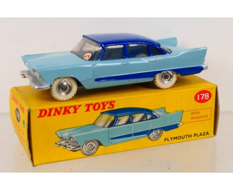 Dinky Toys - A boxed Dinky Toys #178 Plymouth Plaza. The model with light blue body, dark blue roof and side flash, spun hubs