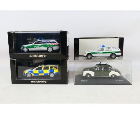 Minichamps - Four boxed Minichamps diecast model Police cars in 1:43 scale. Lot consists of Minichamps #433 171893 Volvo V70 
