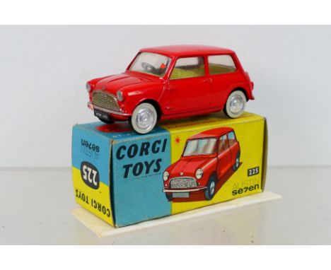Corgi Toys - A boxed Corgi Toys #225 Austin 7 (Mini) Saloon. The model with red body, lemon interior, flat spun hubs, has had