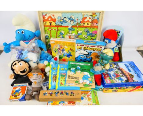 Ravensburger - Le Lombard - A mixed assortment of Smurf related items to include a framed and assembled jigsaw, some boxed vi