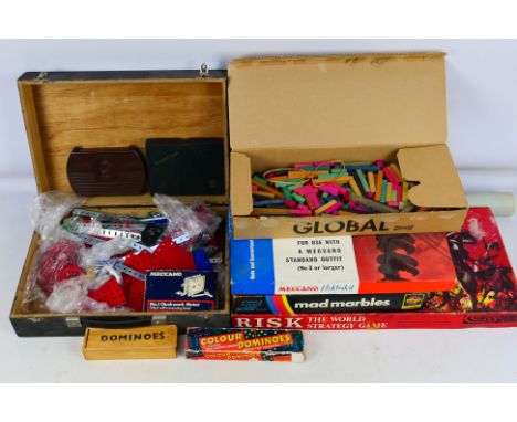 A miscellany of vintage Meccano parts, with some vintage board games and posters. Lot includes a black case containing a quan