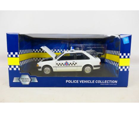 Model Icons - A boxed Limited Edition 1:18 scale Model Icons #999005 Ford Escort 1.1L Section Car 'Essex Police'. The model s