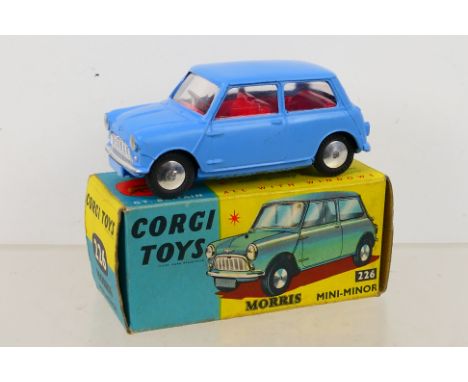 Corgi Toys - A boxed Corgi Toys #226 Morris Mini-Minor. The model with light blue body, red interior, and spun hubs, and appe
