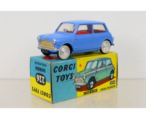 Corgi Toys - A boxed Corgi Toys #226 Morris Mini-Minor. The model with light blue body, red interior, spun hubs with wheel an