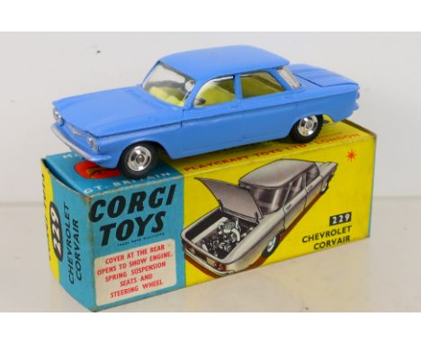 Corgi Toys - A boxed Corgi Toys #229 Chevrolet Corvair. The model in mid blue, lemon interior with spun hubs, has some very l