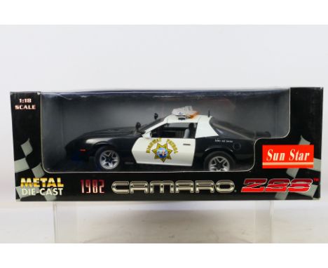 Sun Star - A boxed 1:18 scale Sun Star #1925 1982 California Highway Patrol Camaro Z28. The model shows dusty signs of displa