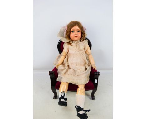 Handwerck - A German bisque headed doll marked H.W. Germany 6 1/2 on the back of the head. This doll has working sleeping blu