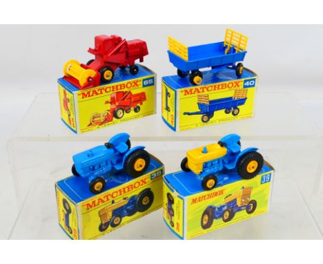 Matchbox - 4 x boxed models, Ford Tractor in blue # 39, Ford Tractor with yellow bonnet # 39, Hay Trailer # 40 and Claas Comb