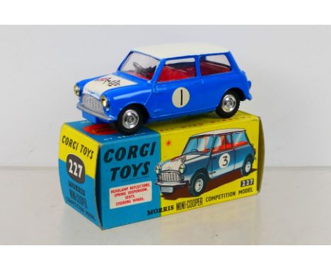 Corgi Toys - A boxed Corgi Toys #227 Morris Mini-Cooper Competition Model. The model with bright blue body, white roof and bo