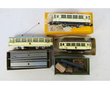 Hamo - A fleet of three HO gauge motorised model trams by Hamo in green and cream livery, with some HO gauge Hamo track, plus
