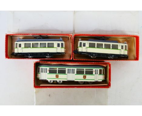 Hamo - Three boxed HO gauge motorised model trams by Hamo in green and cream livery. Lot consists of Hamo T205 (x2) with T126