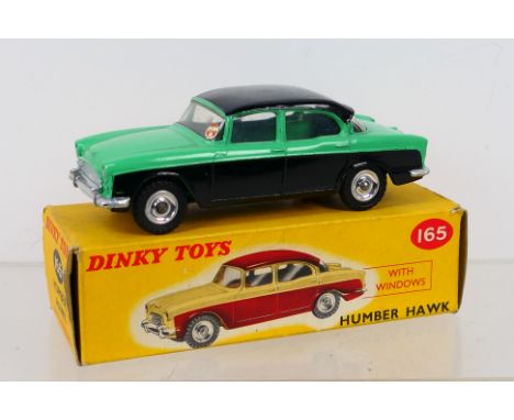 Dinky Toys - A boxed Dinky Toys #165 Humber Hawk. The model with black and green lower body, black roof, and spun hubs, has s