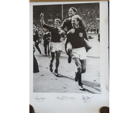 Three 1966 World Cup Players signed 60cm x 42cm sized print of Jack Charlton, Alan Ball and Roger Hunt celebrating after winn