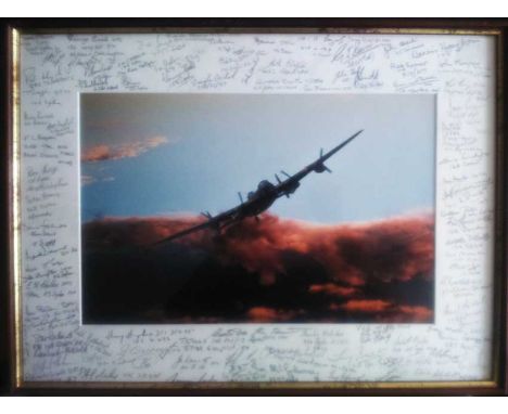 Lancaster Print signed by over 90 WW2 Bomber veterans. 50cm x 40cm framed colour print of a Lancaster in flight signed in pen