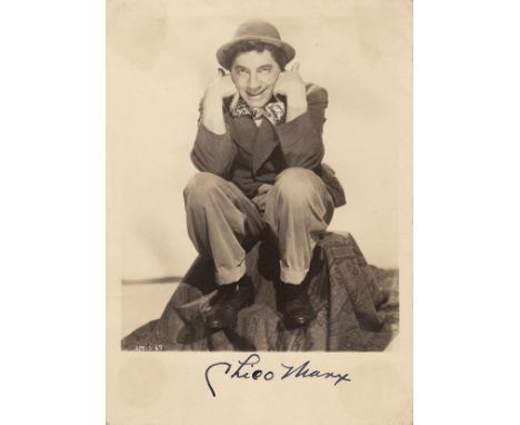 Chico Marx An 12.5cm x 17.5cm B&W photo of Chico Marx and signed by him in dark blue ink. In overall very good condition cons