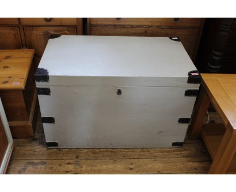 A late 19th Century painted trunk with metal straps and corner brackets