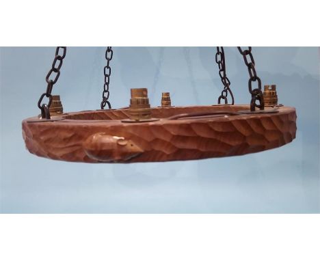 A Robert 'Mouseman' Thompson of Kilburn, circular oak hanging ceiling light, with four sconces and having a large carved mous