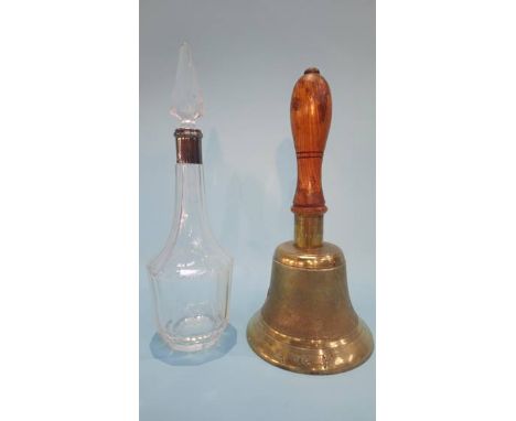 An 'ARP' hand bell and a clear glass decanter 