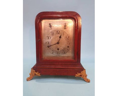 An oak cased mantel clock, with eight day movement, chiming action