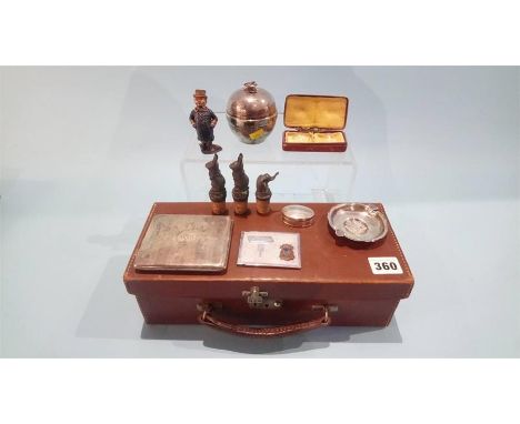 A leather case, containing a silver cigarette case, ashtray etc.