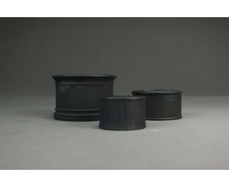 A Neale and Co black basalt inkwell with engine turned decoration, circa 1800, impressed 'Neale & Co', 8cm diameter, a Wedgwo