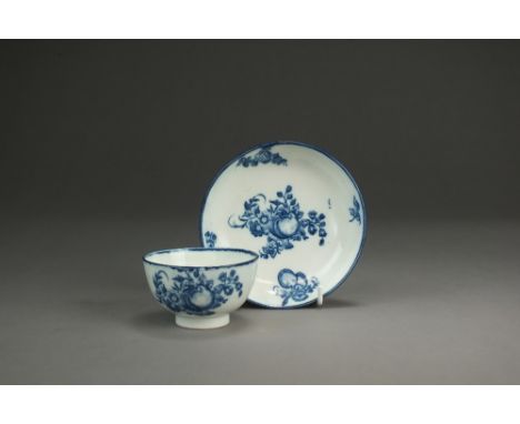 A Caughley porcelain tea bowl and saucer,circa 1775-80,transfer-printed in the Apple and Damson pattern, Sx mark, tea bowl 8c