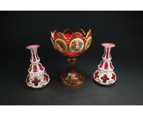 A Bohemian ruby glass cameo vase, late 19th century,the glass cut with milk glass overlay and upper scalloped rim detailed wi