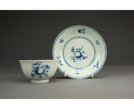 A rare Caughley porcelain tea bowl and saucer,circa 1785, painted with a central Damson between a concentric line and wave bo