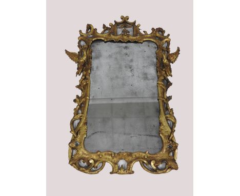 A George III carved giltwood wall mirror, with open bracket and C-scroll frame mounted with a bird to each upper side and bel