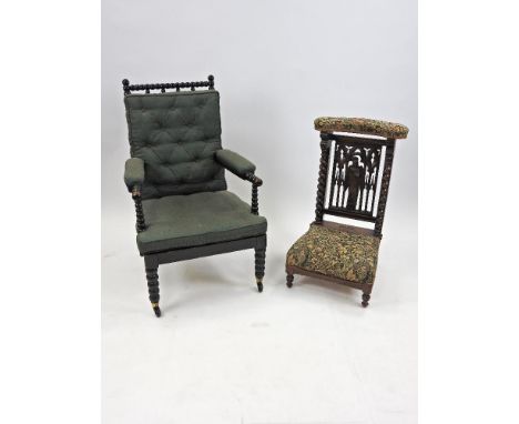 A Victorian ebonised spindle back easy chair, the bobbin turned rail back and arms with later padded green button down uphols