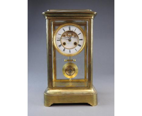 A late 19th-century French four-glass mantel clock with visible escapement by S. Marti of Paris, the stout brass case with fo