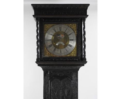 A third quarter of the 18th century oak 30-hour longcase by Thomas Lister of Halifax, the profusely carved oak case has a fla