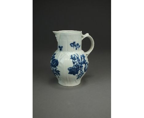 A Caughley porcelain mask head jug cabbage leaf jug,circa 1785,transfer-printed in underglaze blue with flowers, unusually ve