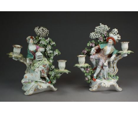 A pair of Derby porcelain twin-branch candlestick groups representing Liberty and Matrimony,circa 1759-69,both seated before 