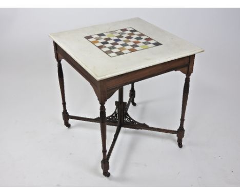 A late Victorian walnut marble topped chess table, the square bevelled white top inlaid with a specimen marble chessboard and